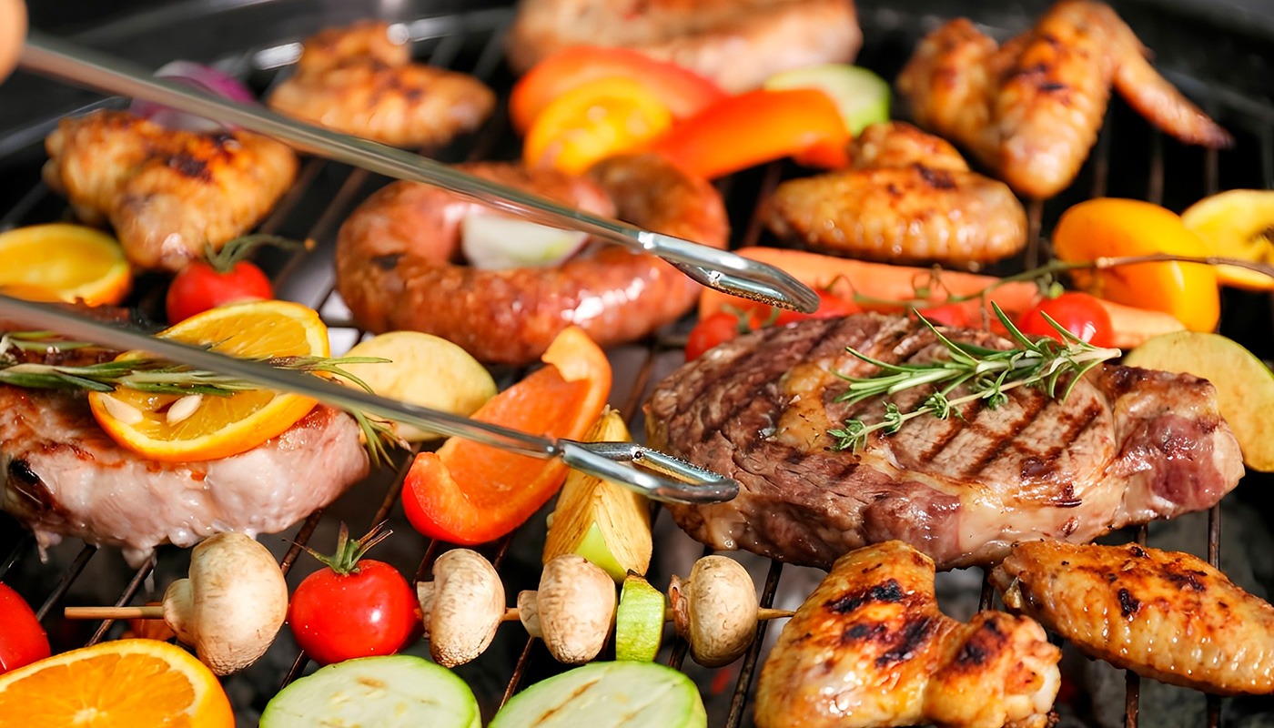 BBQ and grill selection with steak, sausages, grilled chicken and vegetables at Roatan Provision.